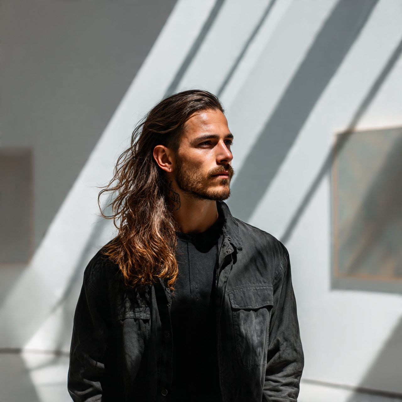 Master the Flow: 27 Long Haircuts for Men Ideas & Tips 23 a man with an asymmetrical long haircut