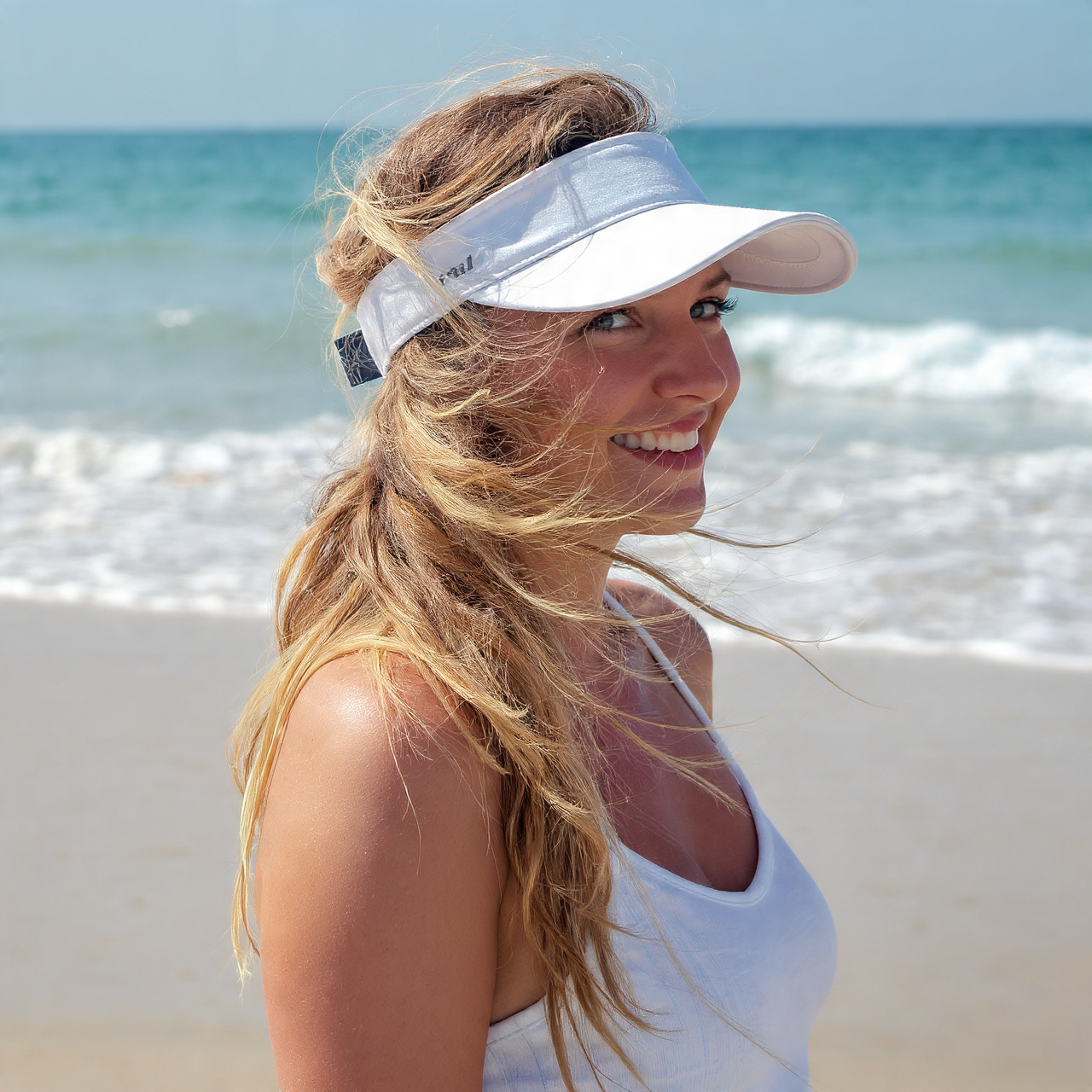 a natural sunlit beach scene featuring a 2