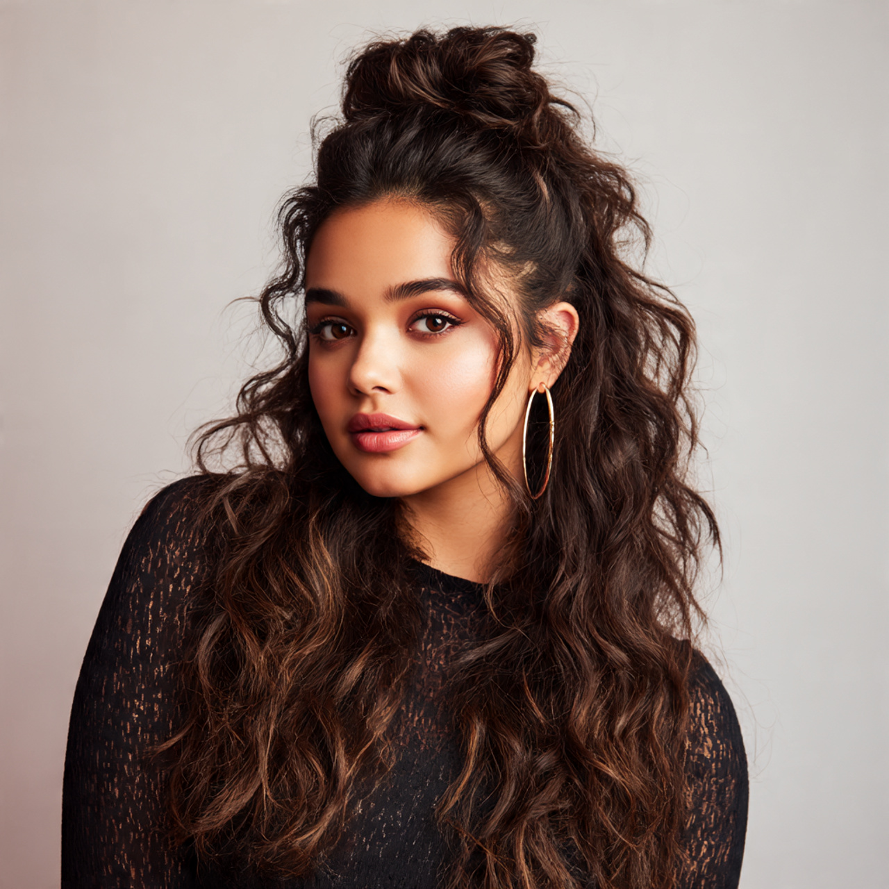 model with voluminous half up half down hairstyle lifted