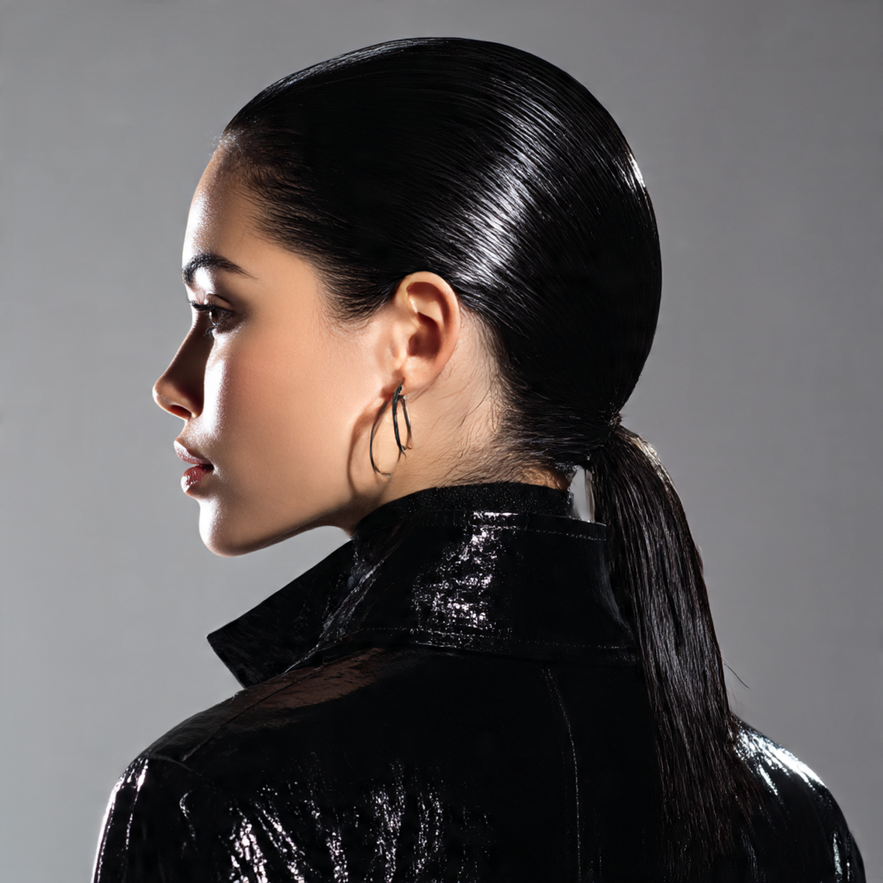 sleek wet look slicked back hairstyle glossy black hair
