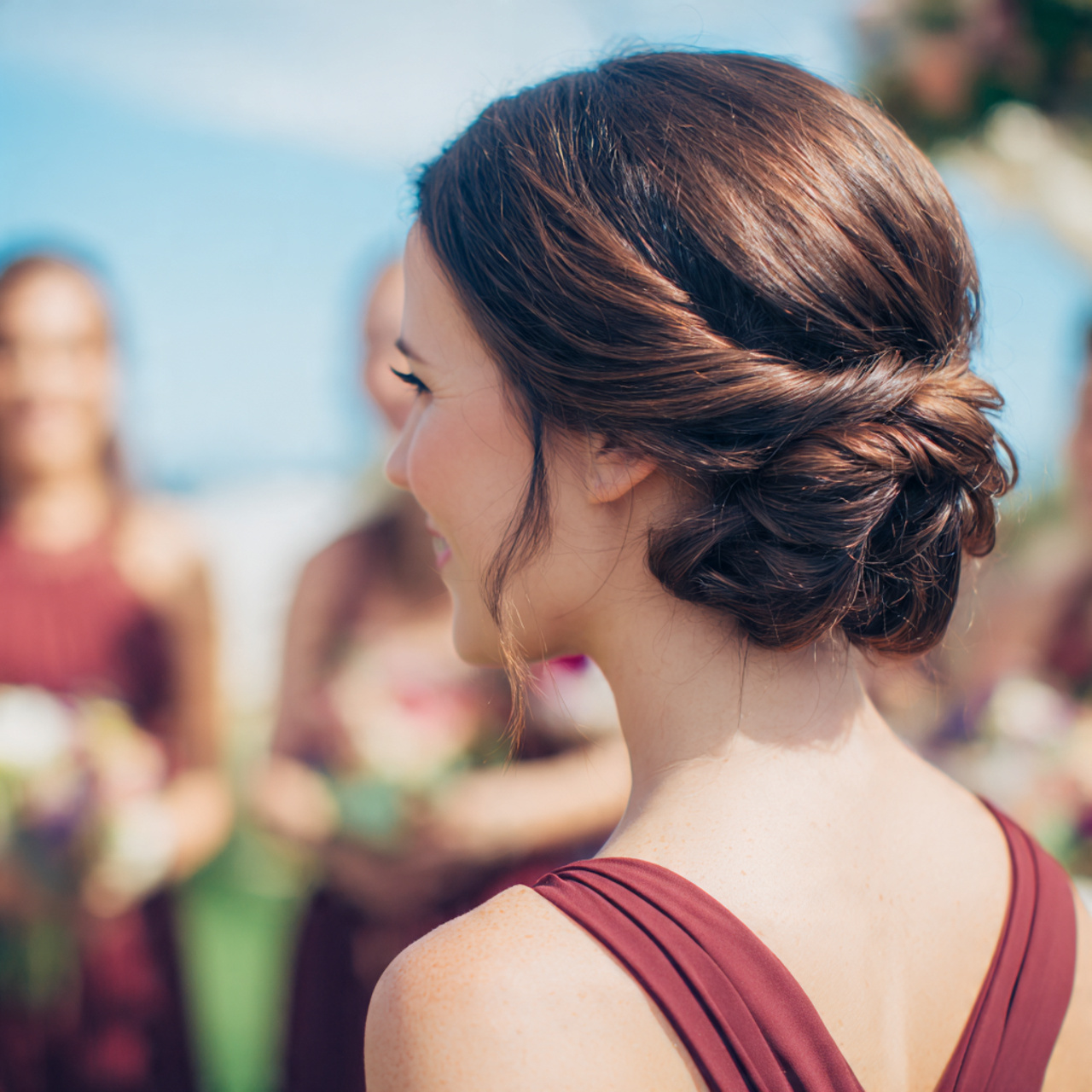 Wedding Bridesmaid Hair: 14 Beautiful & Practical Style Ideas 1 an attractive bridesmaid having textured low bun h
