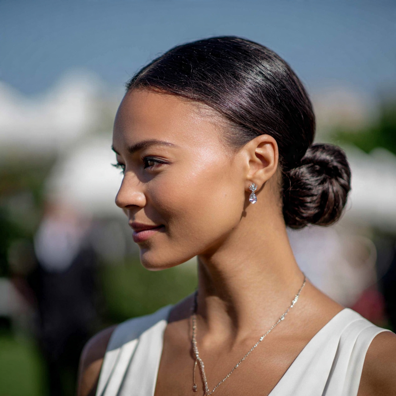 an attractive women with low sleek bun
