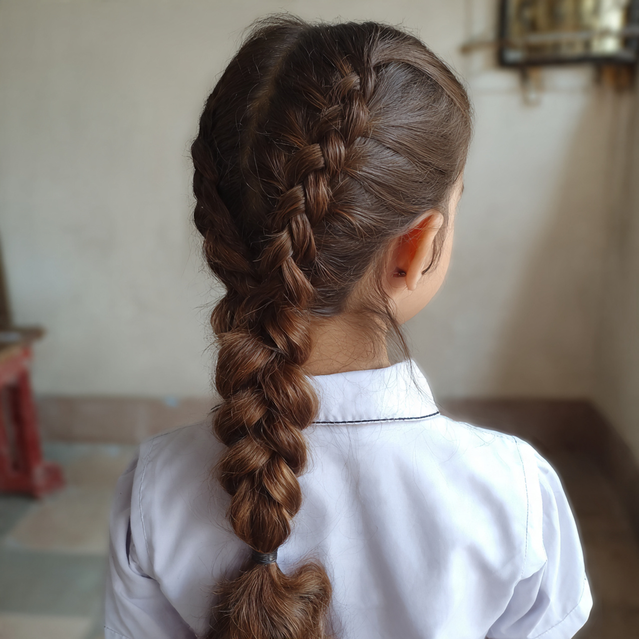 a cute girl having cute easy classic three strand