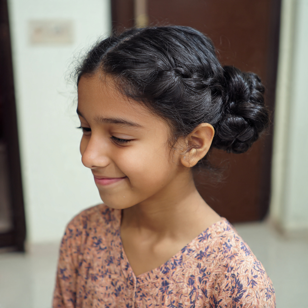a cute girl having cute easy simple low bun hairst