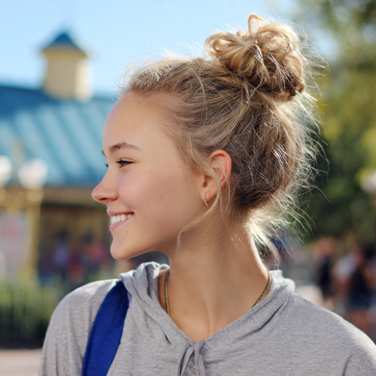 a school teen having easy high messy bun hairstyle
