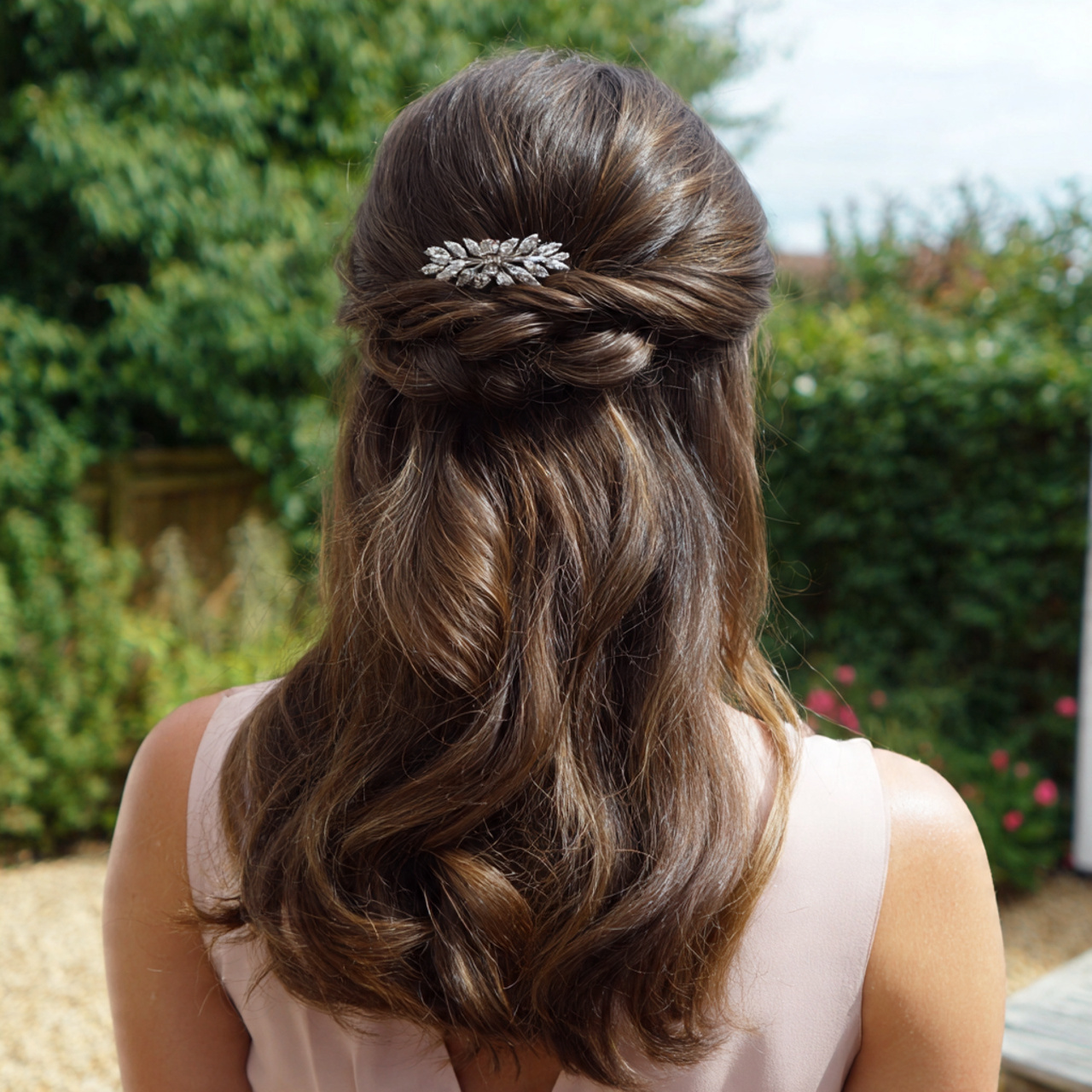 an attractive wedding guest having easy half up so