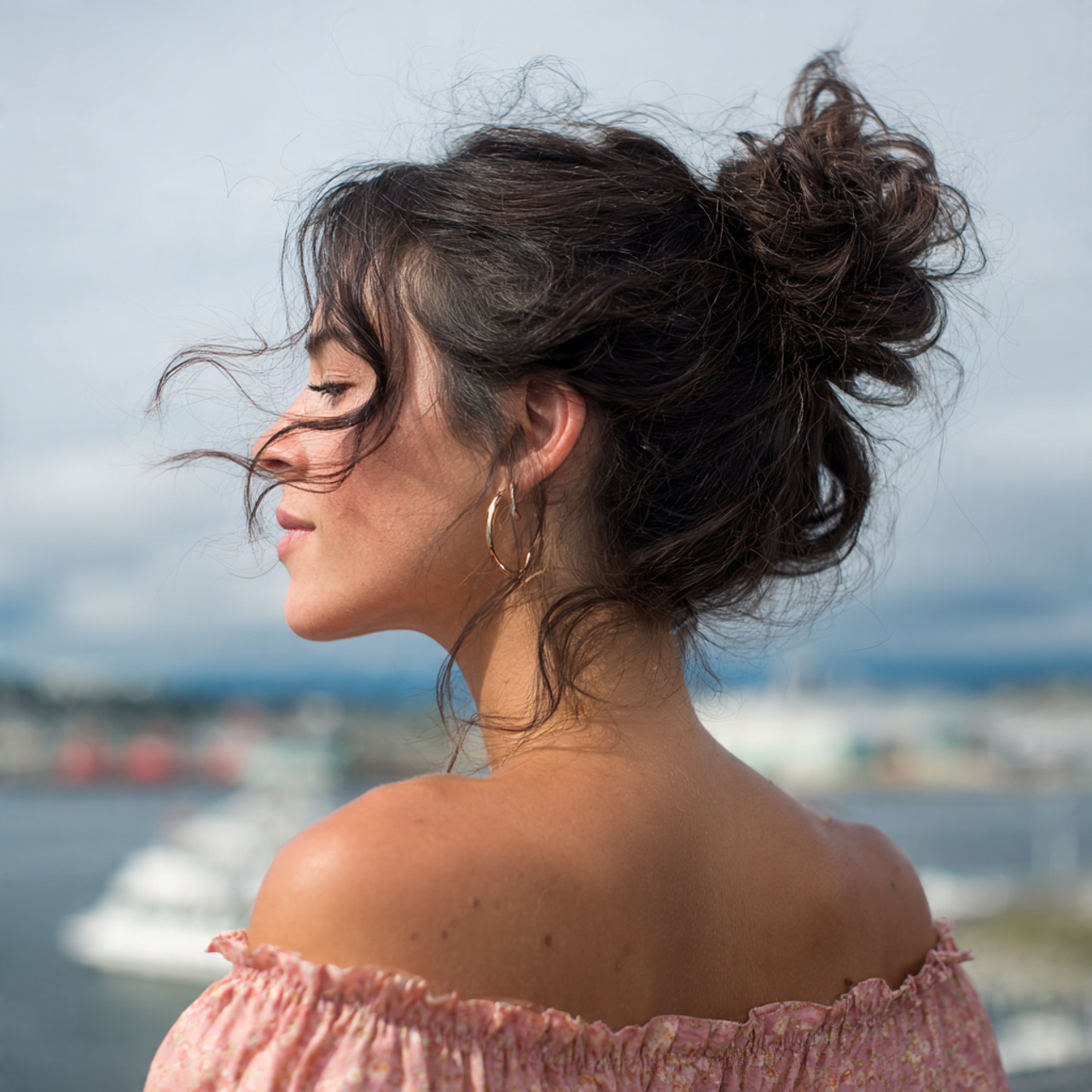 an attractive woman having loose textured bun hair