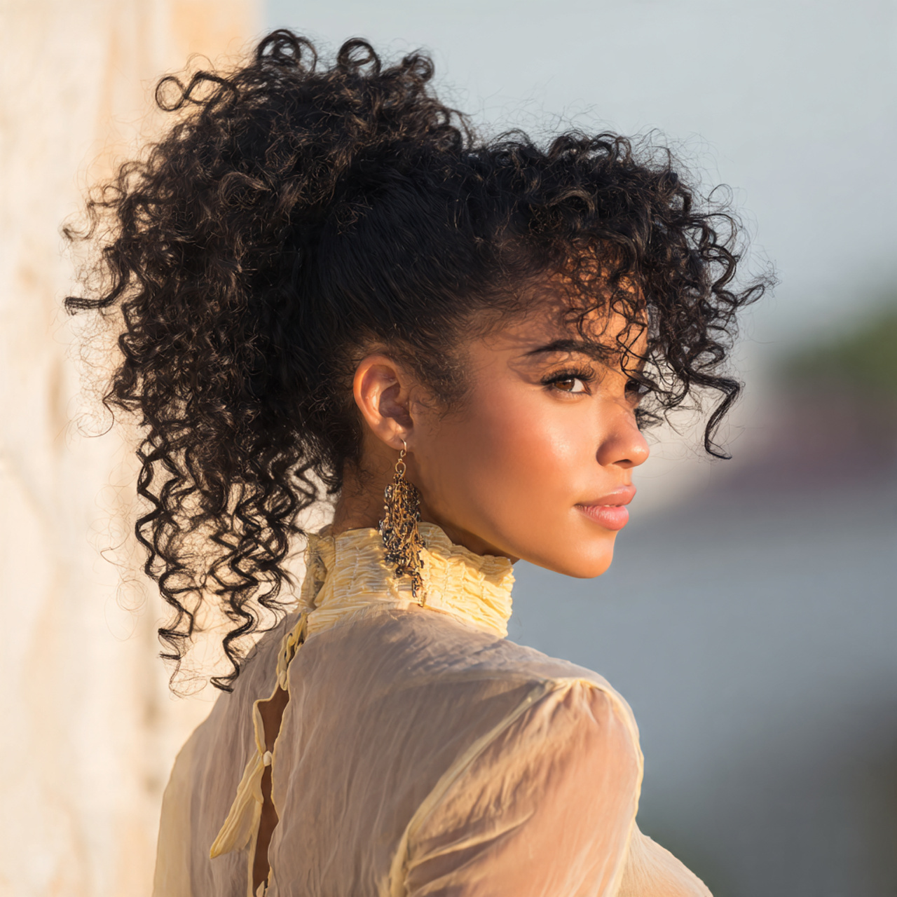 an attractive woman with a cute curly high ponytai