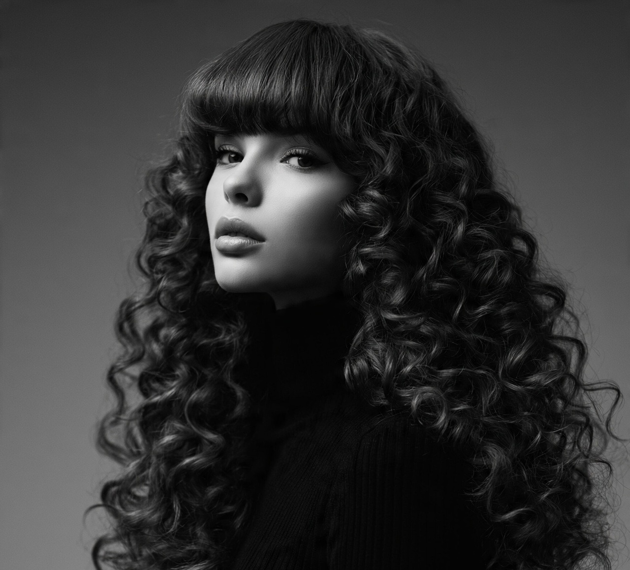 Long Curly Hair With Blunt Bangs