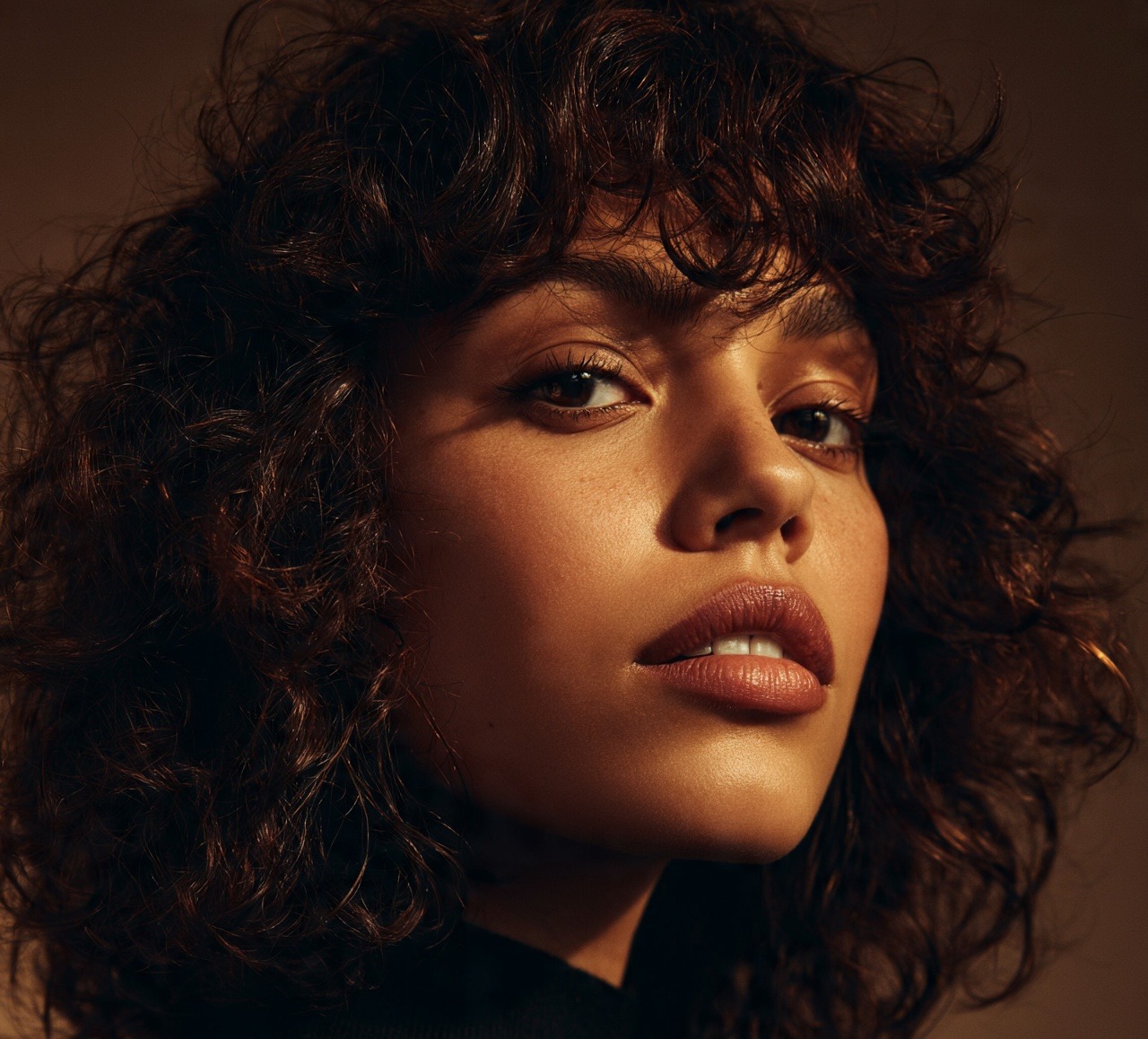Natural Curls With Textured Curtain Bangs