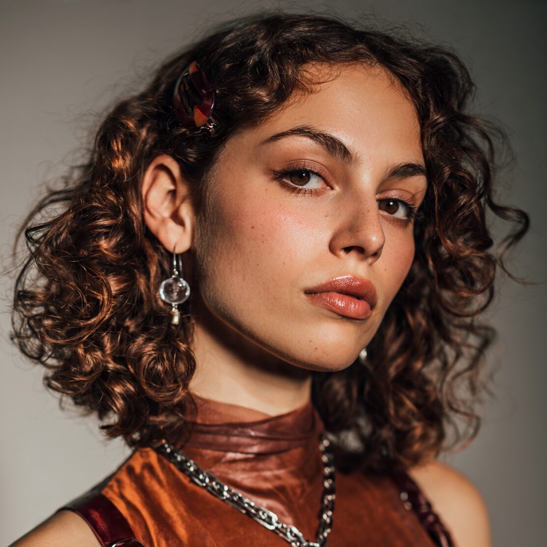 attractive female with medium length curly hair st edited